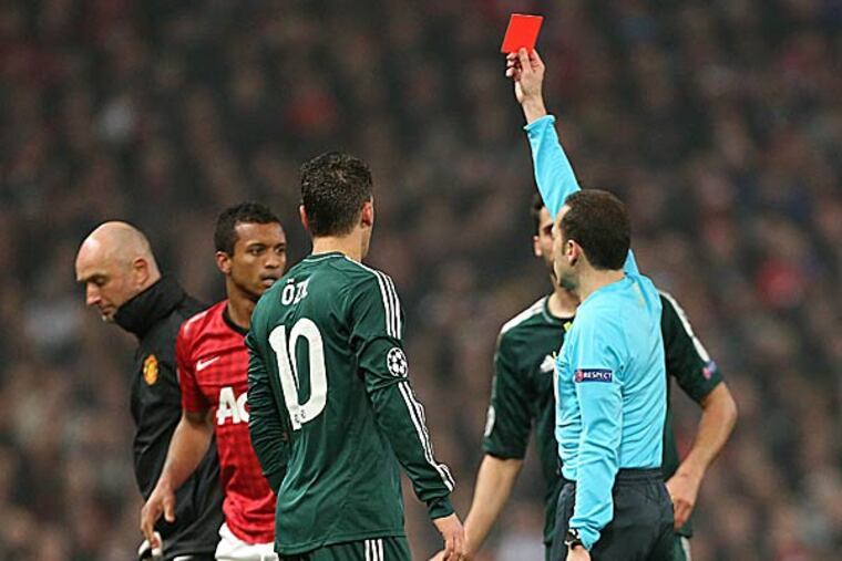 Manchester United's Nani is shown a red card during the Champions League round of 16 soccer match. (Jon Super/AP)