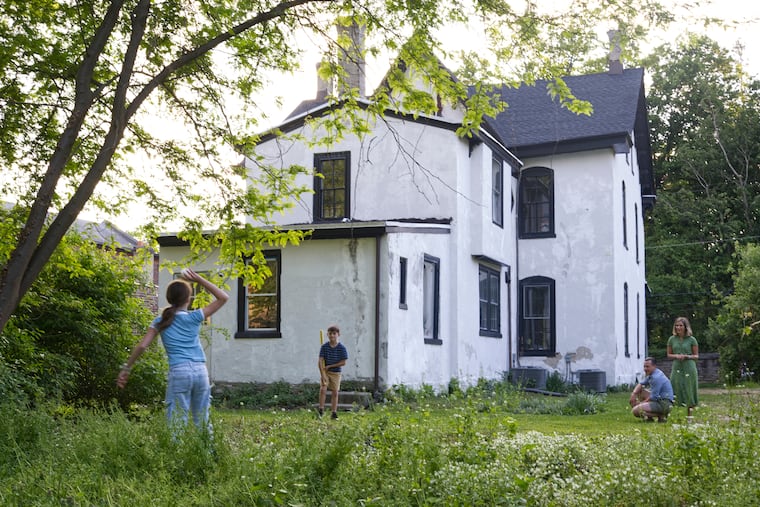 The family likes to play wiffleball in their backyard. 