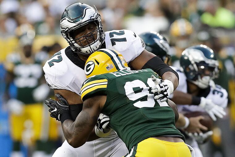 Eagles offensive tackle Halapoulivaati Vaitai blocks Packers linebacker Jay Elliott during a preseason game.