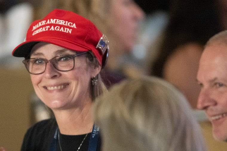 Attendees interact during the Moms for Liberty's annual summit in Philadelphia. Despite protests against the groups, organizers said they felt welcome in the city.