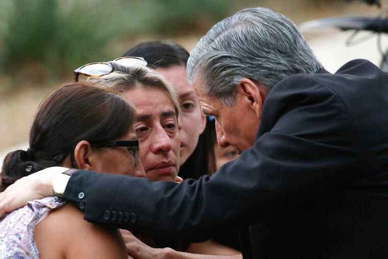 The archbishop of San Antonio, Gustavo Garcia-Siller, comforts families outside the Civic Center following a deadly school shooting at Robb Elementary School in Uvalde, Texas, Tuesday, May 24, 2022.