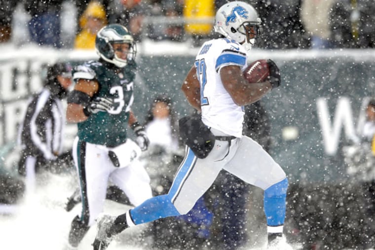 The Lions' Jeremy Ross, right, returns a punt for a touchdown as Philadelphia Eagles' Chris Polk gives chase during the second half of an NFL football game, Sunday, Dec. 8, 2013, in Philadelphia. (Michael Perez/AP)