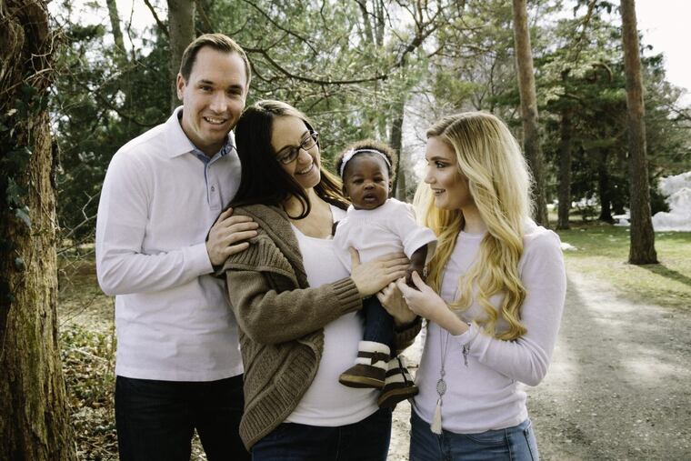 Mike, Kristie, baby Tiana and Mackenzie.