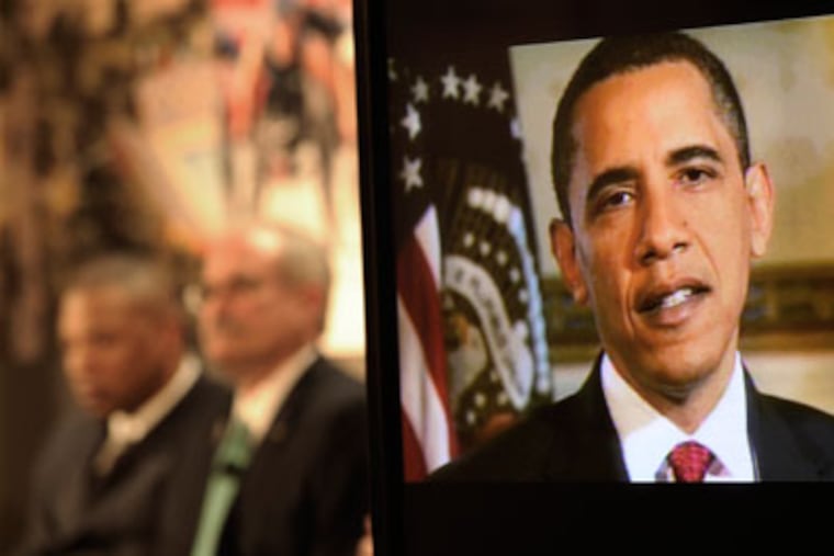 President Barack Obama speaks in a video played during a press conference at the Sheraton Hotel to promote the city's bid to host the 2016 Olympic Games in Chicago. (Paul Beaty/AP file photo)
