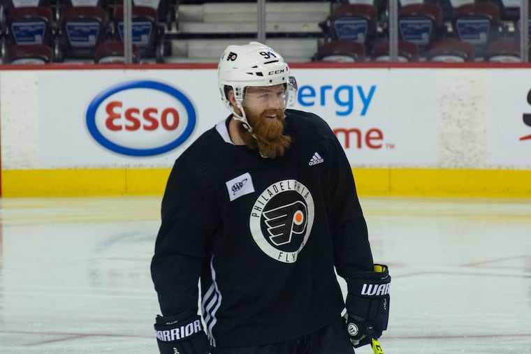 Flyers defenseman Ryan Elliso laughs at the team's morning skate before their game against the Calgary Flames in the Scotiabank Saddledome on Saturday.