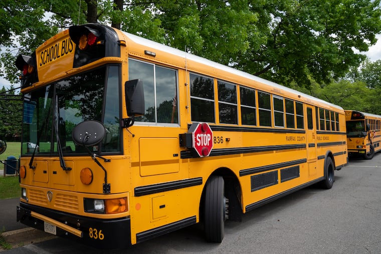 Fairfax County Public School buses parked at a middle school in Falls Church, Va. Very few Americans believe schools should return to normal operations this fall, a new poll says, even as President Donald Trump insists that’s what parents and students want.