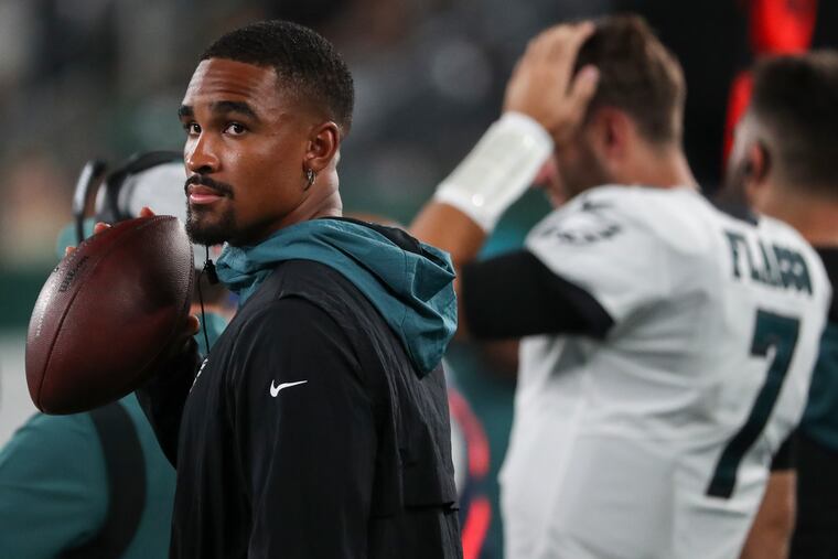 Eagles quarterback Jalen Hurts stands on the sideline in the fourth quarter of the preseason game against the New York Jets.