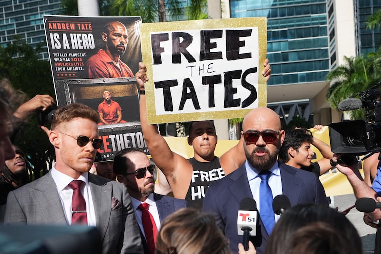 Attorney Joseph McBride, right, who represents Andrew and Tristan Tate as they fight extradition to the United Kingdom on charges of rape and sex trafficking, speaks to news media before a bond hearing at the C. Clyde Atkins U.S. Courthouse in Miami, Thursday, Aug. 27, 2026. (AP Photo/Lynne Sladky)