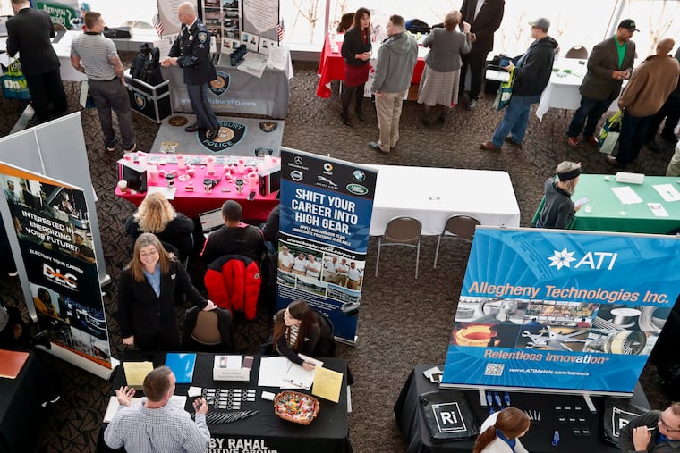 Visitors to the Pittsburgh veterans job fair meet with recruiters at Heinz Field in Pittsburgh March 7. While unemployment is down nationally, writes Lance Haver, too many Americans still struggle to cover their day-to-day expenses.
