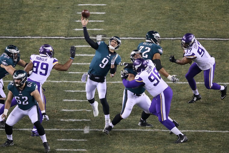 The Eagles had to go through the Vikings in January 2018 on their way to Super Bowl LII. Nick Foles launches a pass during the Eagles' 38-7 victory.
