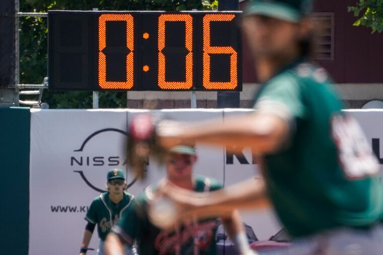 A pitch clock is deployed to restrict pitcher preparation times during a minor league baseball game between the Brooklyn Cyclones and Greensboro Grasshoppers, July 13, 2022, in the Coney Island neighborhood of the Brooklyn borough of New York. Major League Baseball is set to announce a pitch clock and limits on defensive shifts next season in an effort to shorten games and increase offense. The sport’s 11-man competition committee is set to adopt the rules changes Friday, Sept. 9.