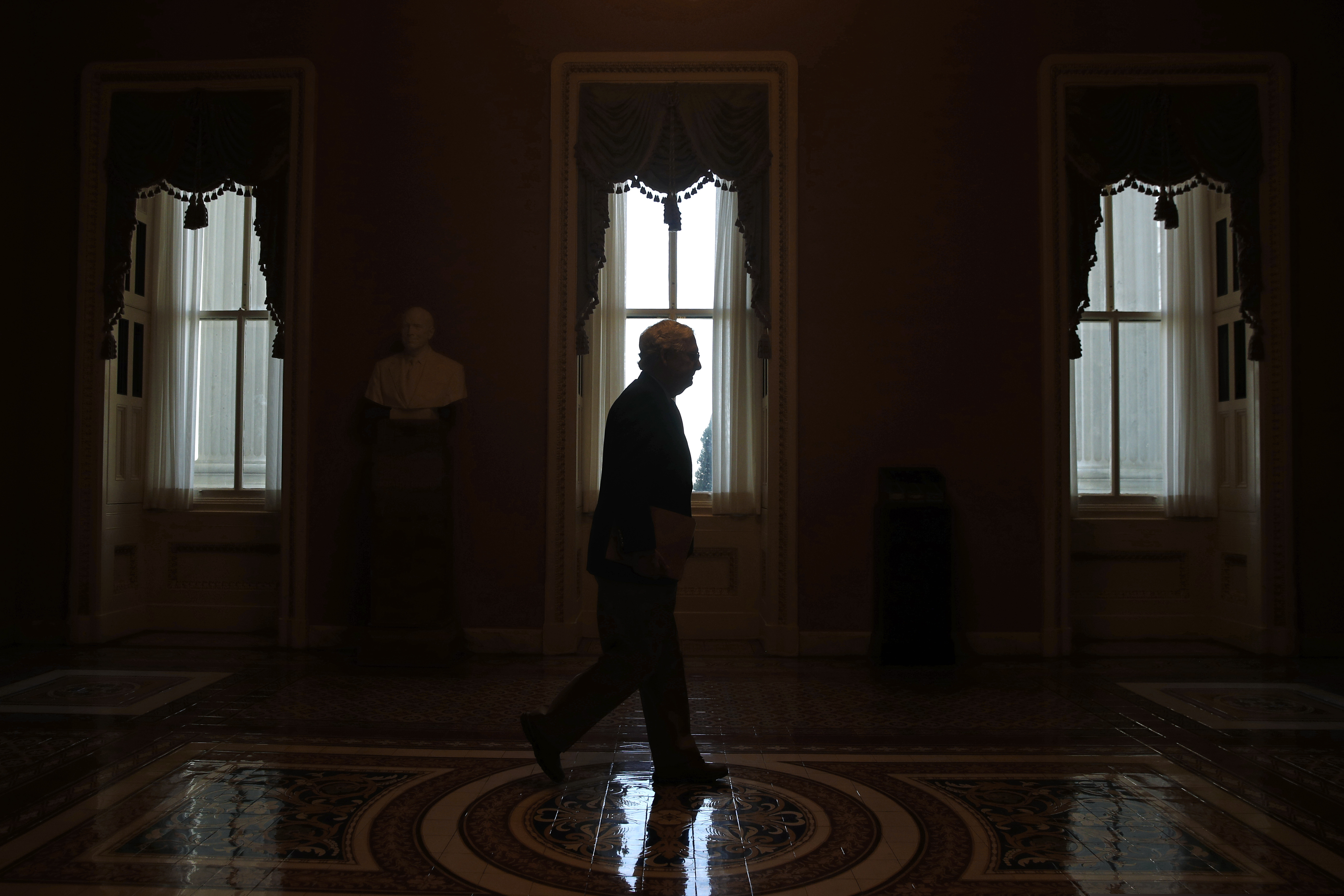 In this April 9 photo, Senate Majority Leader Mitch McConnell walks to the Senate chamber on Capitol Hill in Washington. The Senate is set to resume Monday.