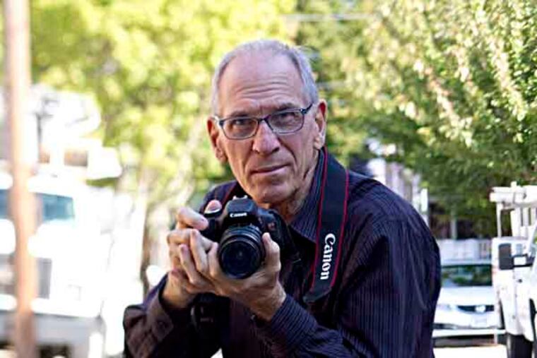Local photographer Chuck Putnam, photographed near his home in S. Philly, is putting up photos, insight and streetwise advice on “Humans of Philadelphia.” Photos taken at his home, Philadelphia, September 27, 2013. ( DAVID M WARREN / Staff Photographer )
