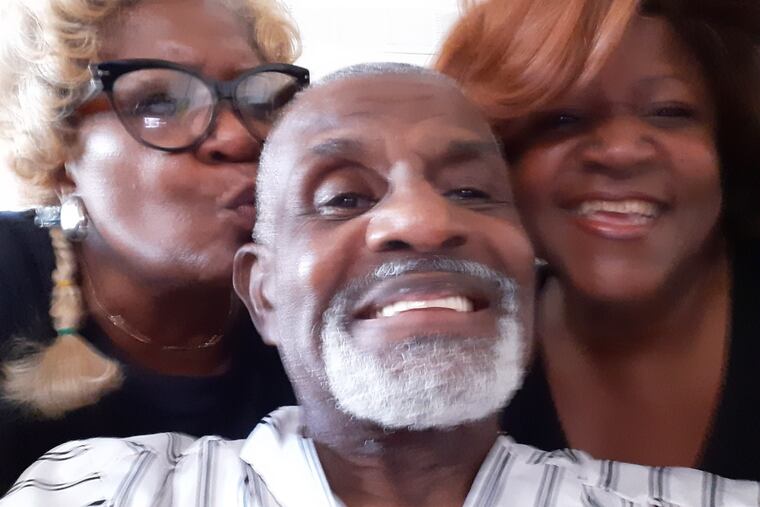 Robert Louis Stevenson Sr., with daughters Rhonda Stevenson, left, and Shawn Woods, right.