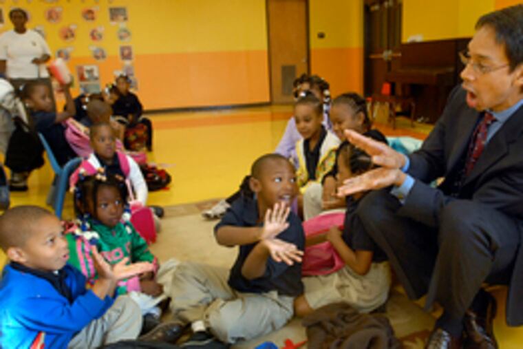 John Alston, the music professor who helped found Chester Upland School for the Arts, leads students in a singalong.