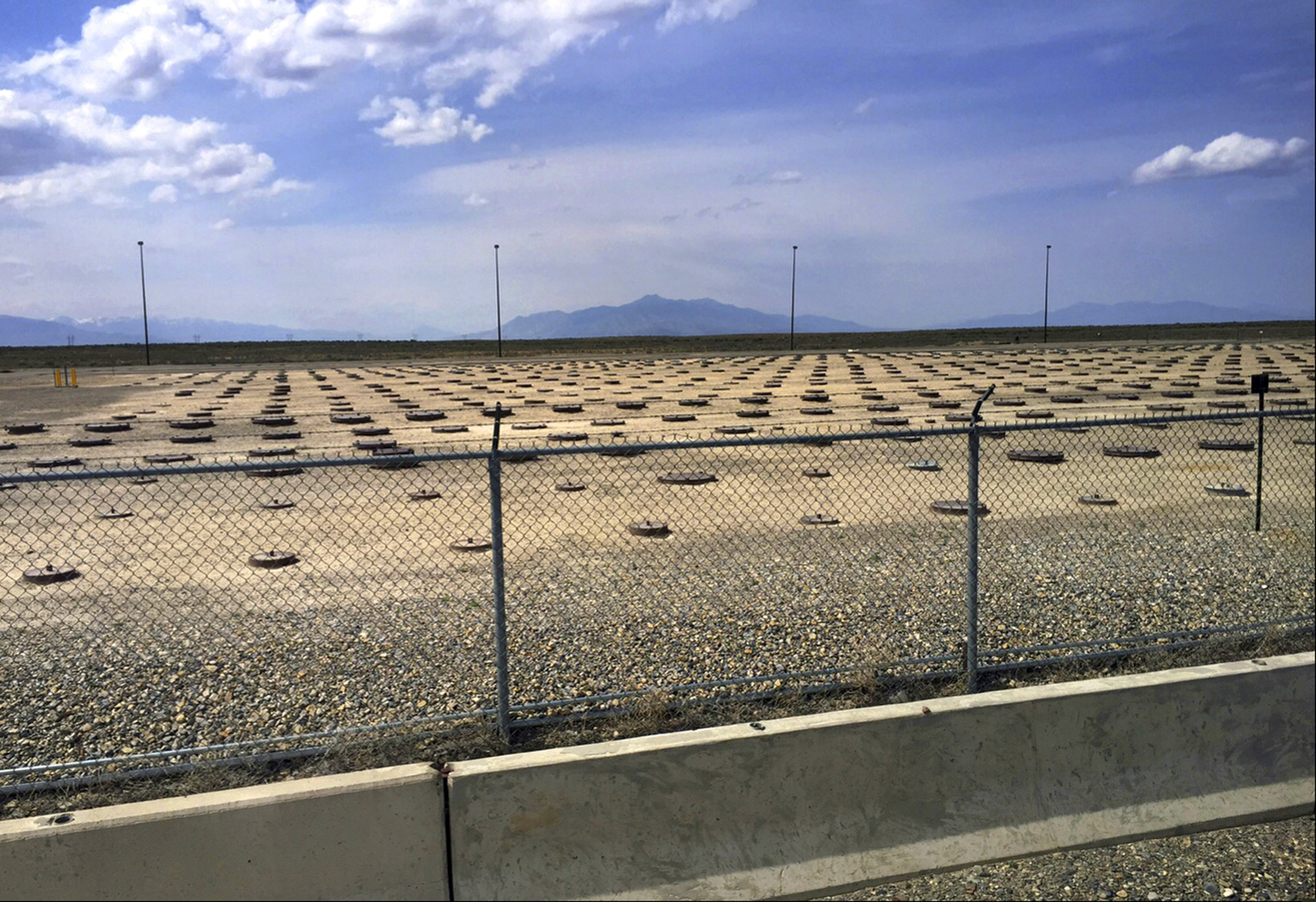 FILE - This May 11, 2015 file photo shows nuclear waste stored in underground containers at the Idaho National Laboratory near Idaho Falls, Idaho. Federal authorities want to store the partially melted core from one of the United States' worst nuclear power accidents for another 20 years in Idaho. The U.S. Nuclear Regulatory Commission said Monday, Sept. 16, 2019 it's considering a request from the U.S. Department of Energy to renew a license to store the radioactive debris from the Three Mile Island nuclear power plant. The core of a reactor south of Harrisburg, Pa., partially melted in 1979. (AP Photo/Keith Ridler, File)