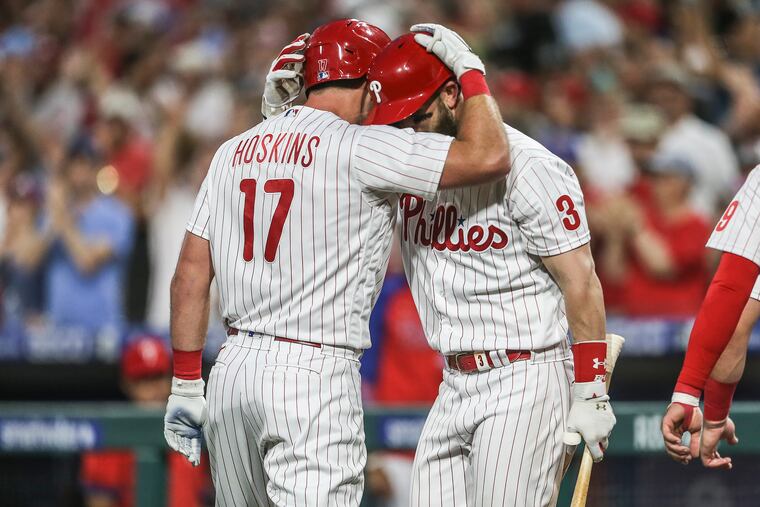 Phillies Rhys Hoskins celebrates his three run home run against the Marlins with teammate Bryce Harper during the 4th inning at Citizens Bank Park in Philadelphia, Wednesday, June 14, 2022