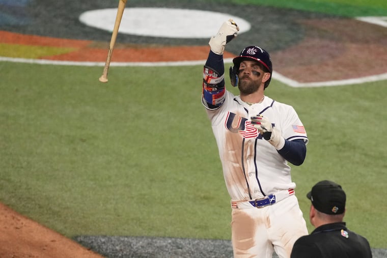 Bryce Harper throws his bat after hitting a home run during the eighth inning in the championship game of the World Baseball Classic against Venezuela, March 17 in Miami.