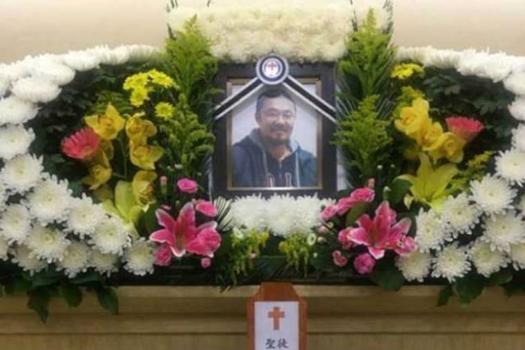 A portrait of Korean adoptee Phillip Clay is displayed at a memorial service held in Korea.