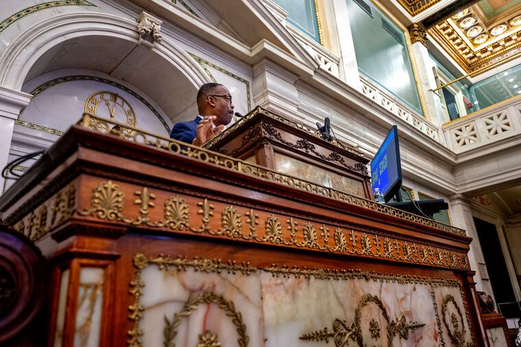 Council president Darrell Clarke steps up to his podium before the start of his last City Council meeting Thursday, Dec. 14, 2023.