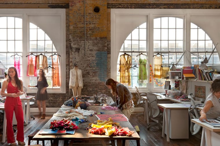 The interior of Building 25, renovated for fashion and accessories retailer Urban Outfitters, is shown in Philadelphia, Pennsylvania, U.S. In keeping with the company ethos of eclectically layering esthetic ideas, blotches of paint and rust were left on walls and supports to convey the varied history of the structure. ( Lara Swimmer via Bloomberg )
