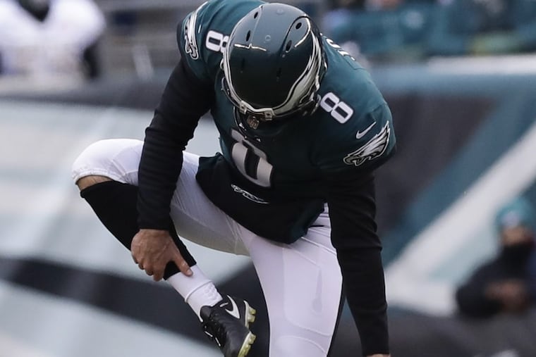 Eagles punter Donnie Jones takes off his warm-up pants on the field before punting the football in the second-quarter against the Dallas Cowboys on Sunday, December 31, 2017 in Philadelphia.