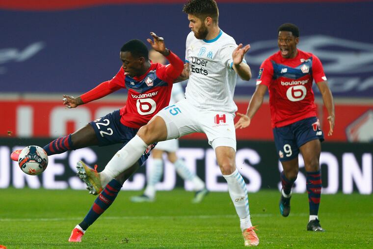 U.S. national team winger Tim Weah (left) has gotten more playing time recently for Lille, which is tied with Paris Saint-Germain for first place in France's Ligue 1.