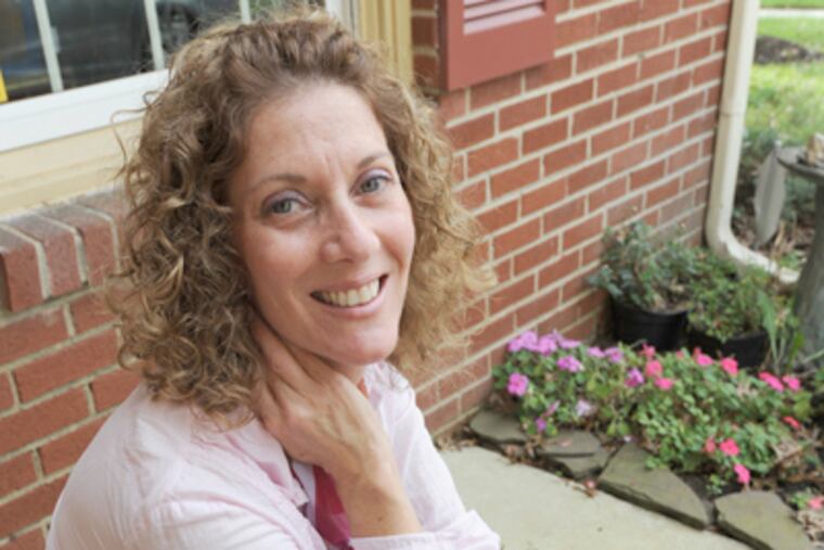 Norma E. Roth at her home in Cherry Hill. One of nine in her family to get breast cancer, she survived and wrote a book to warn others to take precautions. (April Saul / Staff Photographer)