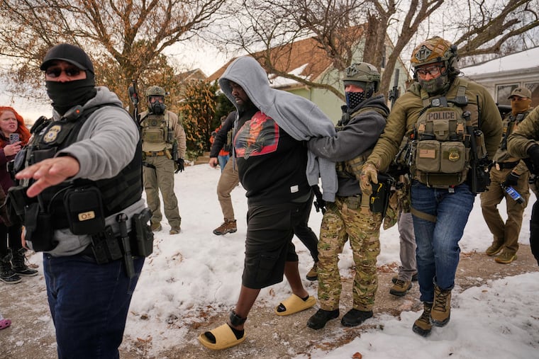 Federal immigration officers arrest a man in Minneapolis on Jan. 11. The Trump administration is engaged in state terror and is trying to convince the U.S. public that people being victimized deserve to be, writes Jane Esberg.
