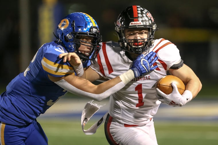 Coatesville's quarterback Ricky Ortega (right) and Downingtown West's Will Mahmud during the District 1 Class 6A championship game on Nov. 22, 2019. Both schools are members of the Ches-Mont League, which voted Friday to shut down fall sports because of the coronavirus outbreak.