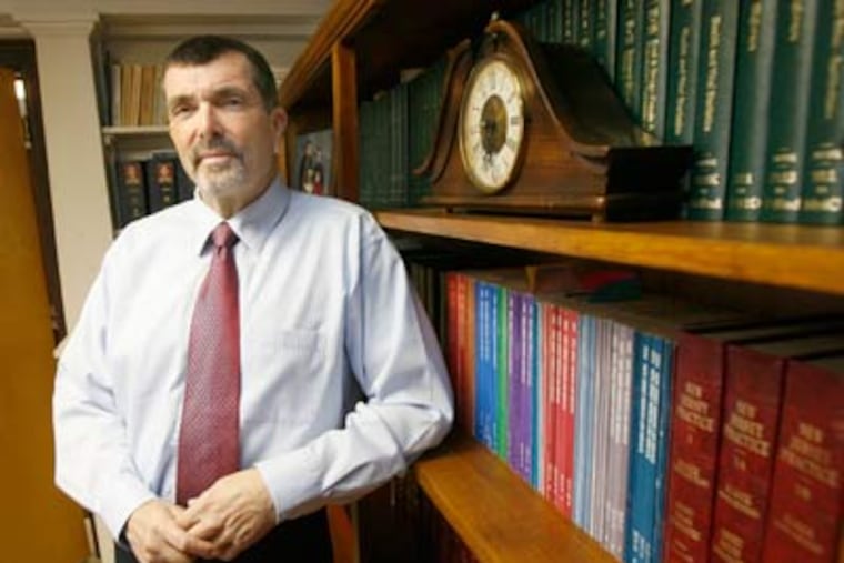 Attorney John D. Jordan, shown in his office, discovered a large theft of funds from one of his senior clients by another lawyer. (Charles Fox / Staff Photographer)