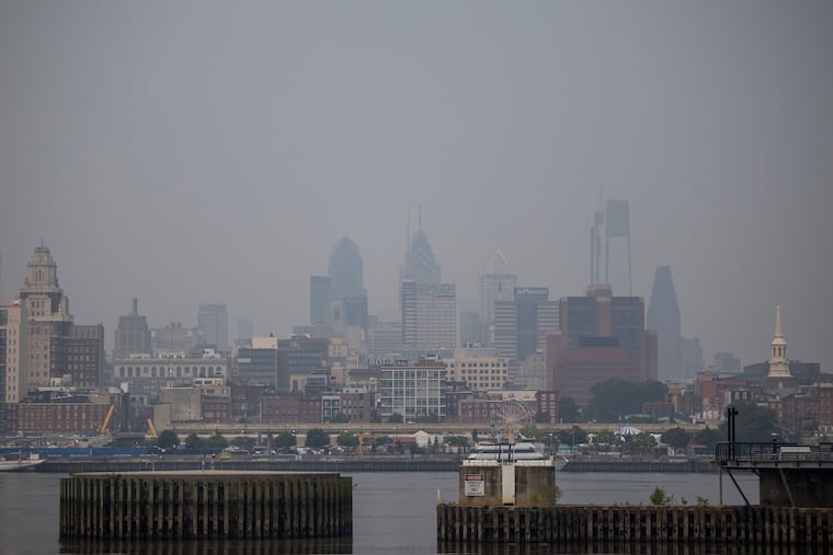 Philadelphia's skyline can barely be seen from Camden, N.J., due to smoke from wildfires in Canada Friday.