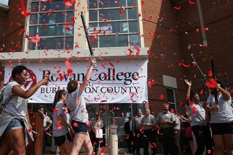 Students cheer as confetti launches during a ceremony in Mount Laurel to celebrate the changing of Burlington County College's name to Rowan College at Burlington County. (DAVID MAIALETTI / Staff Photographer)