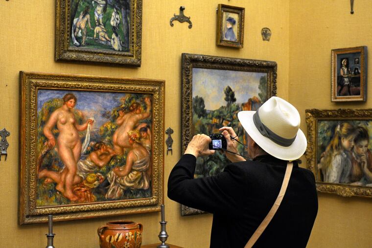 Freelance writer Lou Perri is among those viewing the Impressionist and Modernist masterpieces at the new Benjamin Franklin Parkway campus of the Barnes Foundation during the opening press preview May 16, 2012. ( TOM GRALISH / Staff Photographer )