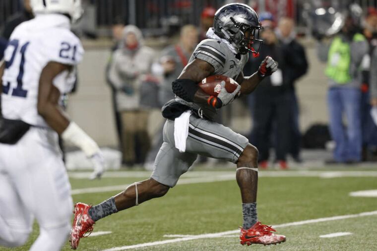 Ohio State receiver Johnnie Dixon, right, scores a touchdown against Penn State during the second half of an NCAA college football game Saturday, Oct. 28, 2017, in Columbus, Ohio. Ohio State beat Penn State 39-38. (AP Photo/Jay LaPrete)