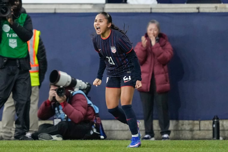 Alyssa Thompson celebrates her late goal that won the game for the United States.