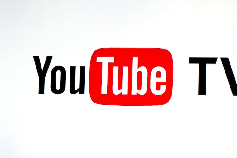 File photo shows the YouTube TV logo at the YouTube Space LA in Los Angeles.