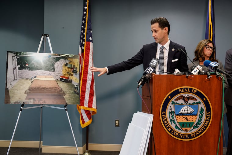 Chester County District Attorney Christopher de Barrena-Sarobe shows a photo of a room where David Vincent Rosa may have committed crimes during a news conference on Monday.