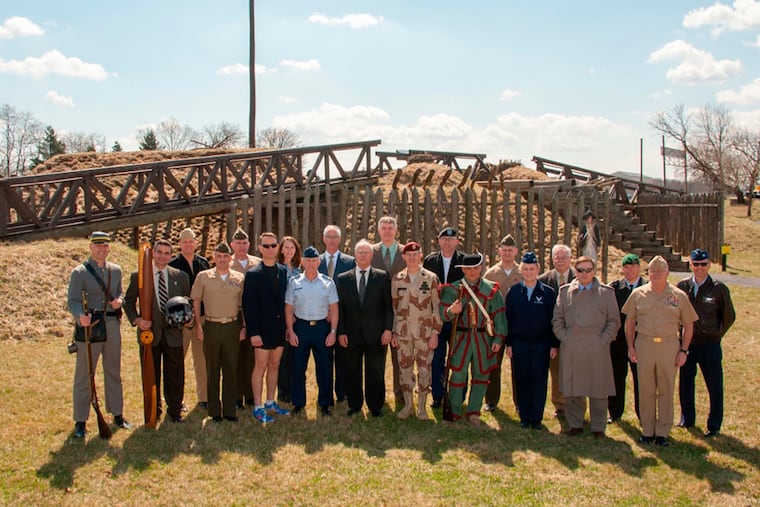 In this 2014 photo provided by the Army War College, Pennsylvania GOP gubernatorial nominee Doug Mastriano, left, poses in a Confederate uniform.