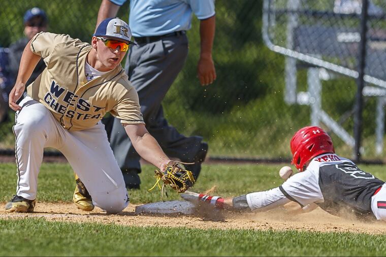 Archbishop Carroll's Tyler Kehoe (9) steals third base in the first inning against West Chester Rustin.