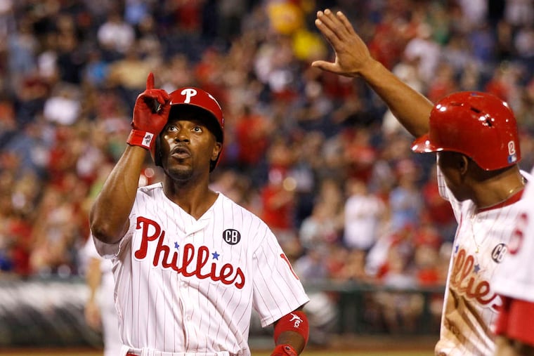 Jimmy Rollins looks skyward after his two-run homer gave the Phillies a 4-3 lead in the fifth inning.