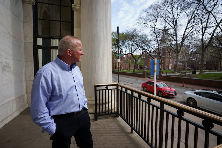 Ken Sher outside his apartment in the Curtis Building, near the Independence Hall clock tower and traffic, which contribute to noise in Philadelphia.