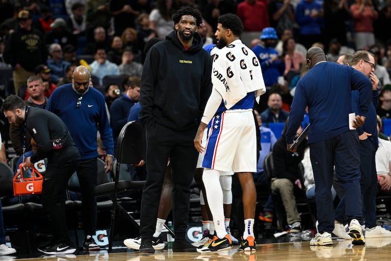 Joel Embiid (left) and Paul George (right) have little trade value for the Sixers.