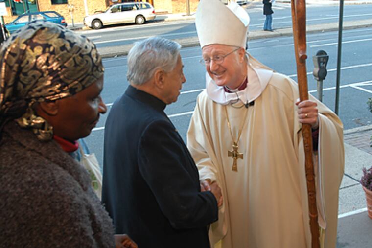 Bishop Charles E. Bennison Jr. (right) is accused of improperly concealing his brother John's sexual abuse of a minor decades ago. (April Saul/Inquirer)