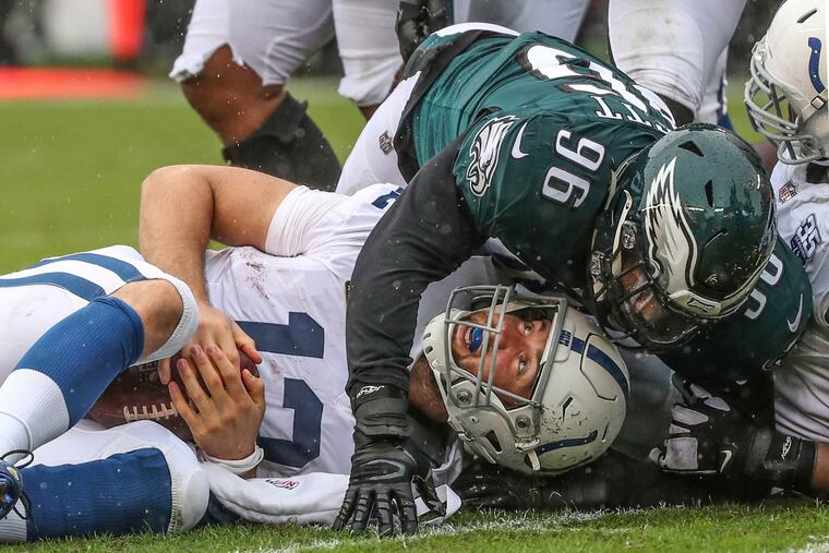 Indianapolis quarterback Andrew Luck is sacked by Eagles Derek Barnett in the second quarter of their game on Sunday , September 23, 2018.