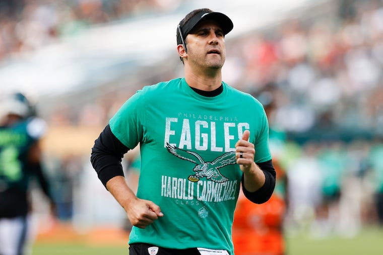 Eagles coach Nick Sirianni running during training camp at Lincoln Financial Field.
