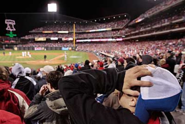Andrew Mangeluzzi, of Lower Merion, reacts after the Yankees scored to go ahead in the top of the ninth inning last night. ( Elizabeth Robertson / Staff Photographer )