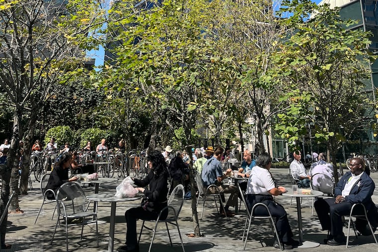Comcast's outdoor plaza welcomed back lunchtime crowds, Thursday, Sept. 15, 2022. The company asked workers to return three days a week in the office.