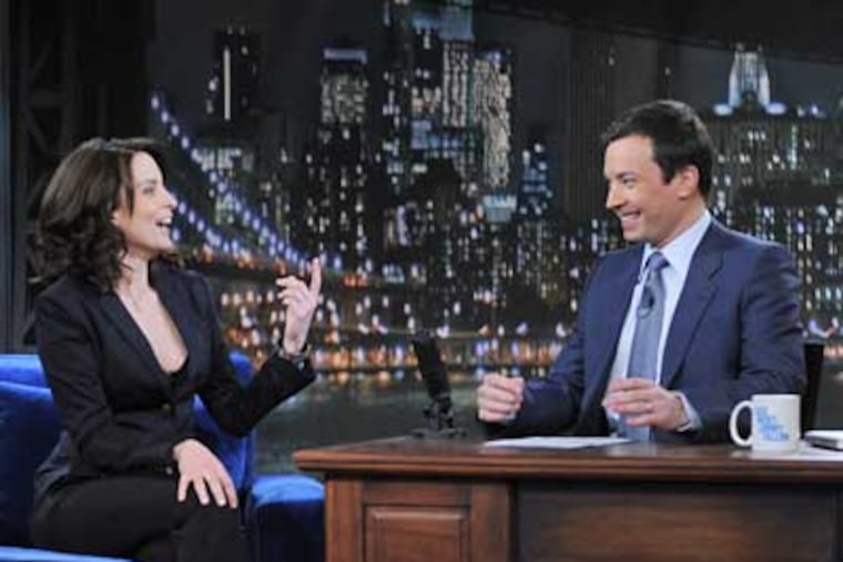 Jimmy Fallon, right, interviews Upper Darby native Tina Fey in his first days as Conan O'Brien's replacement. (Dana Edelson / NBC Photo)