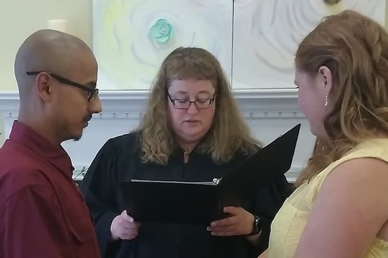 Cumberland County Magisterial District Judge Elizabeth Beckley presides over Alex Parker's (left) and Krisha Schmick's May 2017 wedding.